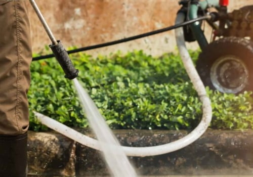 Are there any special considerations when using an adjustable water temperature feature on a powerwasher?